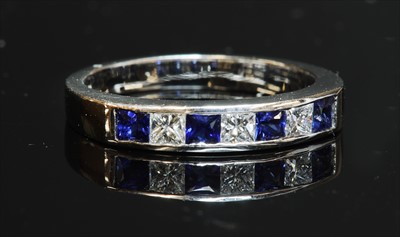 Lot 201 - An 18ct white gold sapphire and diamond half eternity ring
