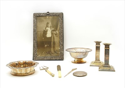 Lot 38A - A white metal photograph frame with embossed foliate decoration