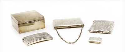 Lot 64 - A Victorian silver card case with scrolling foliate decoration