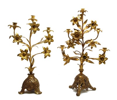 Lot 512 - A near pair of continental gilt candle stands