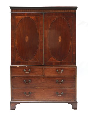 Lot 556 - A mahogany linen press