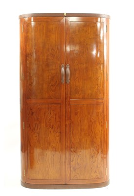 Lot 554 - A 'Starbay Malaga' rosewood finish bow front wardrobe