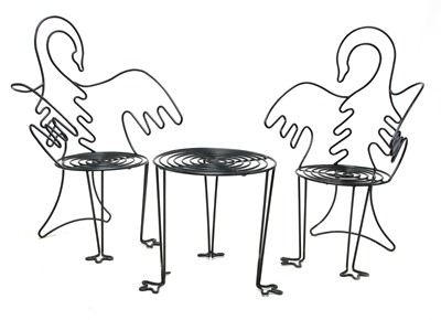Lot 1247 - A pair of ‘Swan’ wire work garden chairs and a small table