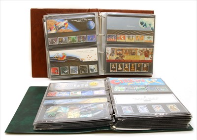 Lot 222 - Two well filled presentation pack albums from 1981 to  2006