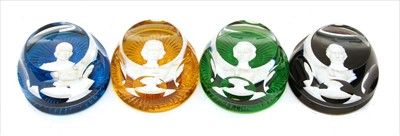 Lot 374 - Four vari coloured Baccarat paperweights