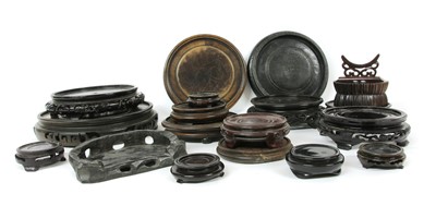 Lot 947 - A collection of Chinese wood stands