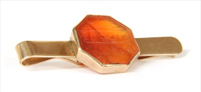 Lot 2 - A gold cornelian tie slide