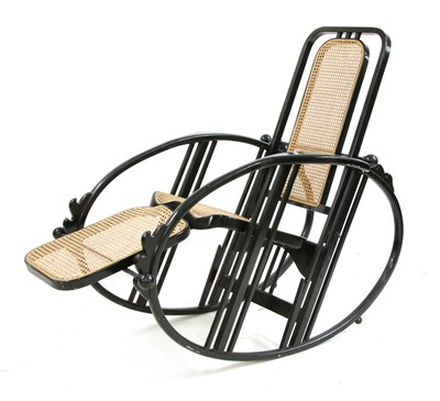 Lot 186 - An ebonised wooden rocking chair