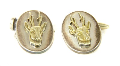 Lot 33 - A pair of silver gilt stag cufflinks, by Holland & Holland