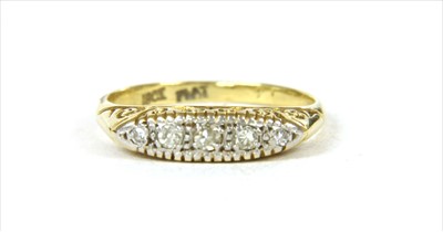 Lot 23 - A gold boat shaped five stone diamond ring