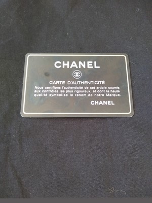 Lot 411 - A Chanel black lambskin petit flap bag