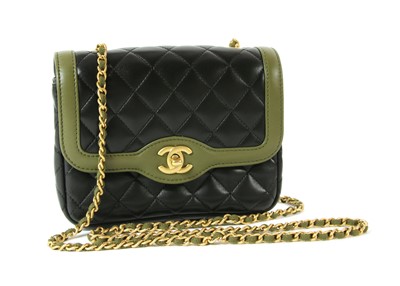 Lot 411 - A Chanel black lambskin petit flap bag