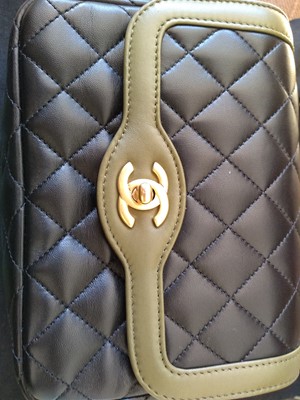 Lot 411 - A Chanel black lambskin petit flap bag