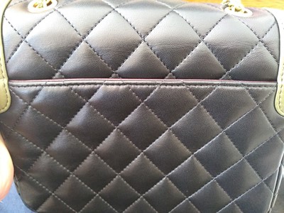 Lot 411 - A Chanel black lambskin petit flap bag