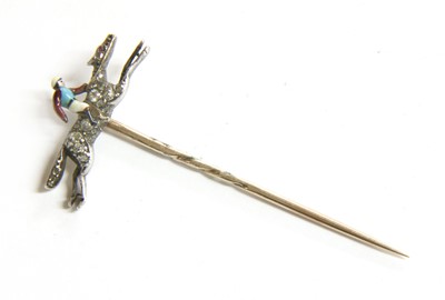 Lot 104 - A diamond and enamel jockey on horseback stick pin