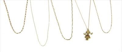 Lot 32 - A gold rag doll pendant and chain