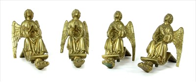 Lot 264 - A set of four gilt metal cabinet feet