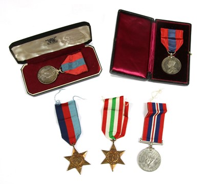 Lot 438 - A George V Imperial Service medal