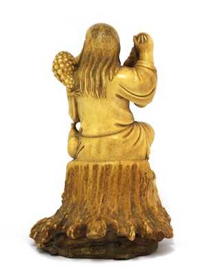 Lot 81 - A Chinese stag antler carving of Liu Hai