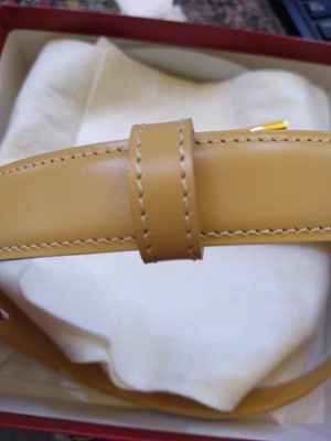 Lot 247 - A Cartier beige leather 'Love' belt