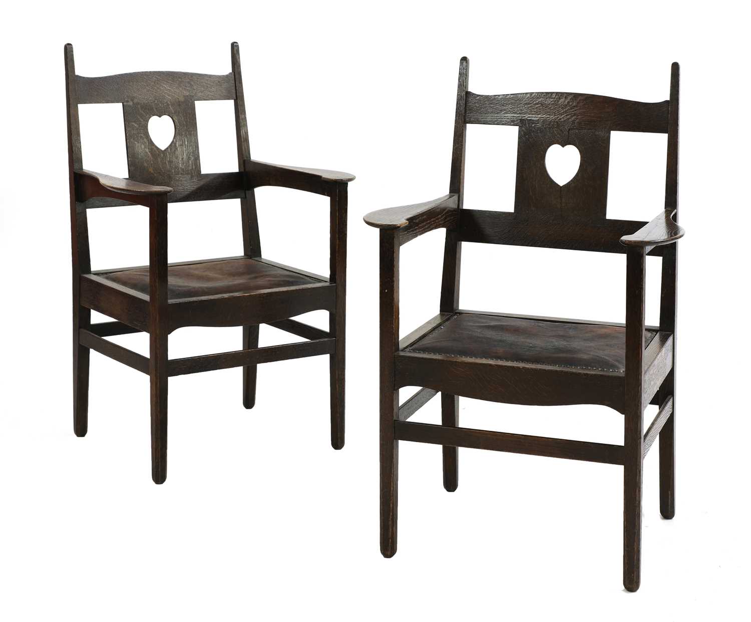 Lot 224 - A pair of rare Arts and Crafts oak armchairs