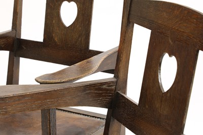 Lot 224 - A pair of rare Arts and Crafts oak armchairs