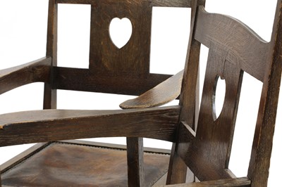 Lot 224 - A pair of rare Arts and Crafts oak armchairs