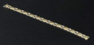 Lot 187 - A Continental two colour gold hollow bracelet