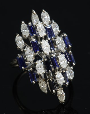 Lot 195 - A white gold diamond and sapphire marquise-shaped cluster ring