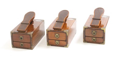 Lot 555 - Three 'Starbay Portland' rosewood finish shoe shine boxes