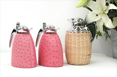 Lot 1207 - Three hot water jugs