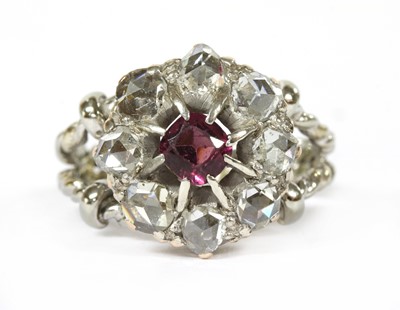 Lot 216 - An Edwardian garnet and diamond cluster