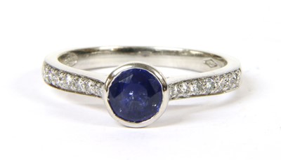 Lot 61 - A platinum sapphire and diamond ring