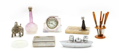 Lot 276 - An Art Deco glass mantel clock