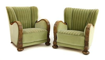 Lot 529 - A pair of 'Art Deco' carved oak easy chairs