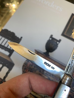 Lot 23 - Three silver and mother-of-pearl combination folding fruit knives