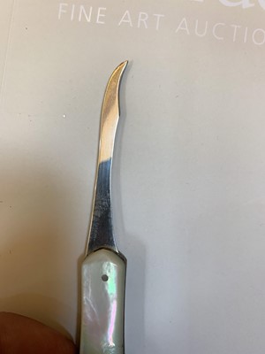 Lot 23 - Three silver and mother-of-pearl combination folding fruit knives