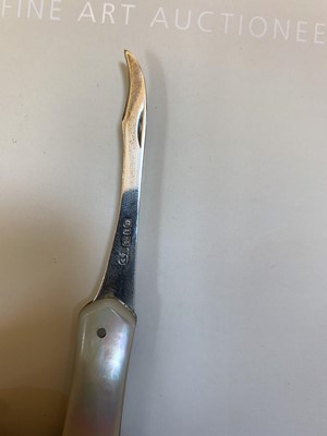 Lot 23 - Three silver and mother-of-pearl combination folding fruit knives
