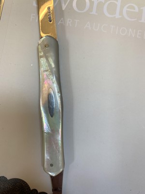 Lot 23 - Three silver and mother-of-pearl combination folding fruit knives