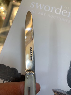 Lot 23 - Three silver and mother-of-pearl combination folding fruit knives