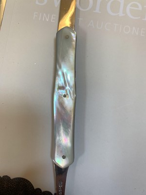 Lot 23 - Three silver and mother-of-pearl combination folding fruit knives