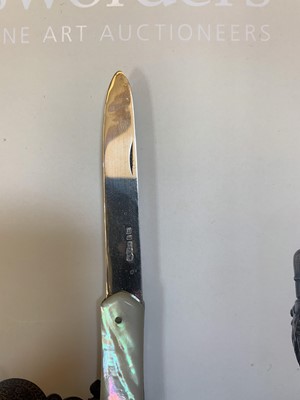 Lot 23 - Three silver and mother-of-pearl combination folding fruit knives