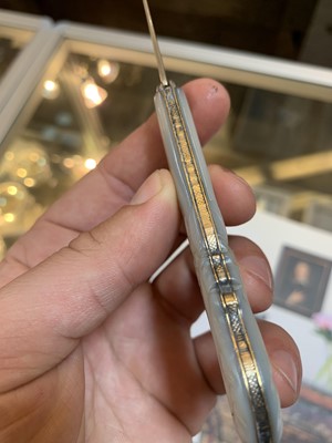 Lot 23 - Three silver and mother-of-pearl combination folding fruit knives