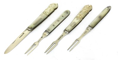 Lot 25 - Three silver and mother-of-pearl folding fruit forks and a knife