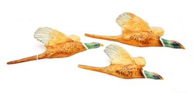 Lot 555 - A graduated set of Beswick Pheasant wall plaques