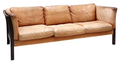 Lot 414 - A Danish tan leather three-seater settee