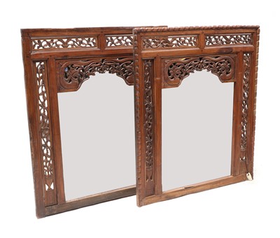 Lot 896 - Two carved East Asian mirrors