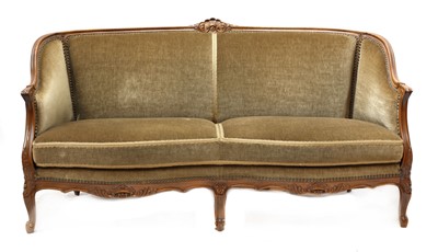 Lot 809 - A beech carved two-seater settee