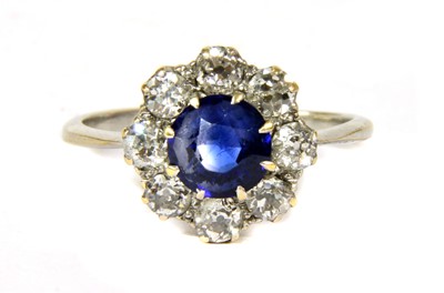 Lot 20 - A white gold sapphire and diamond circular cluster ring