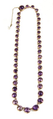 Lot 11 - A Victorian gold amethyst graduated rivière necklace, c.1880